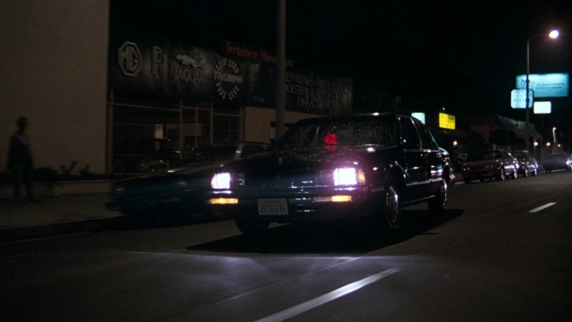 Wide shot frame from Lethal Weapon — walking, plate, street
