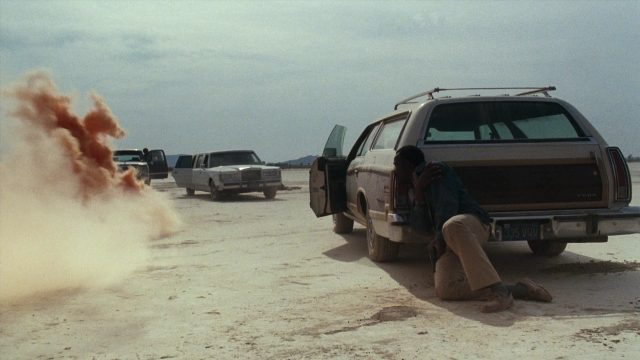 Wide shot frame from Lethal Weapon — plate, door, car