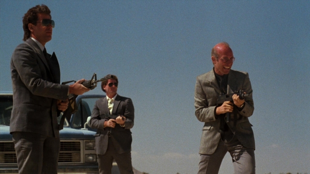 Wide shot frame from Lethal Weapon — standing, dialogue, street