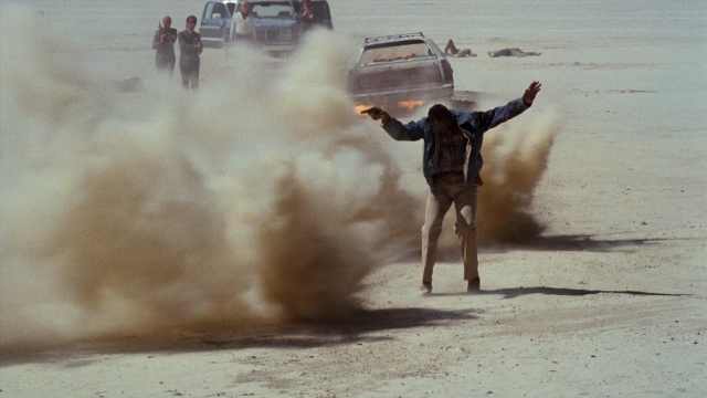Wide shot frame from Lethal Weapon — standing, street, person