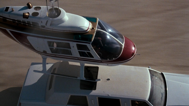 Frame from Lethal Weapon — sitting, car, airplane