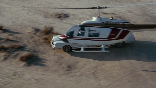 Wide shot frame from Lethal Weapon — car, helicopter, airplane