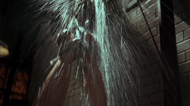 Wide shot frame from Lethal Weapon — standing, room, water