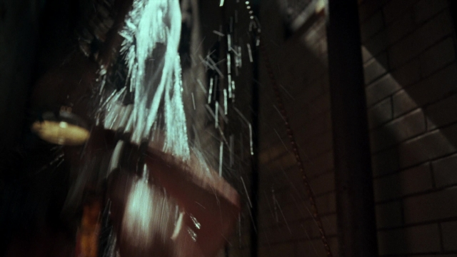 Frame from Lethal Weapon — room, door, face