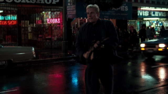 Wide shot frame from Lethal Weapon — walking, dialogue, street