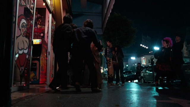 Wide shot frame from Lethal Weapon — walking, dialogue, street