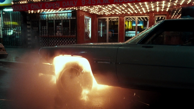 Wide shot frame from Lethal Weapon — street, car, night