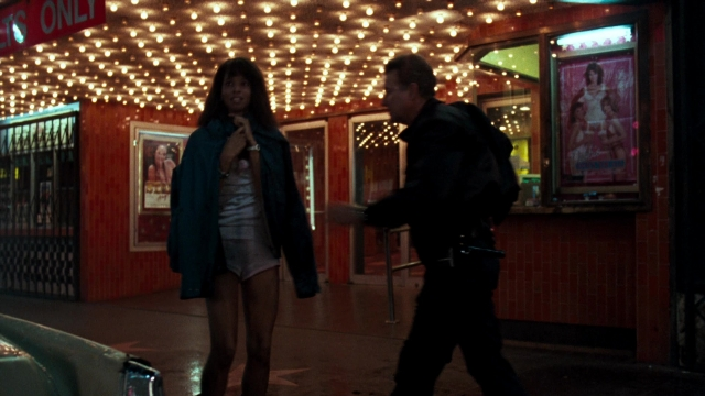 Wide shot frame from Lethal Weapon — walking, dialogue, street
