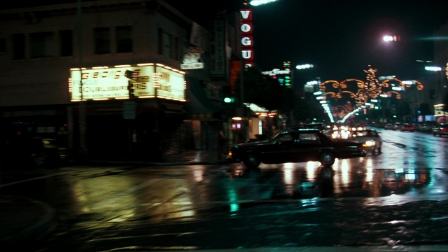 Wide shot frame from Lethal Weapon — street, car, night