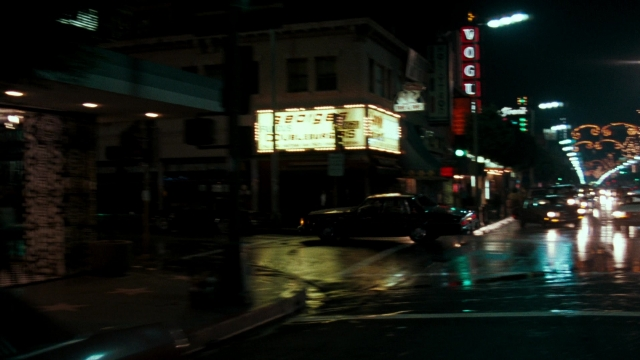 Wide shot frame from Lethal Weapon — street, car, night