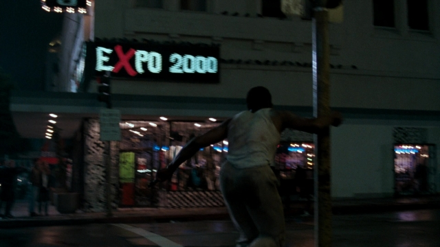 Frame from Lethal Weapon — walking, street, night