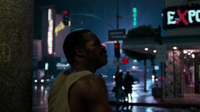 Wide shot frame from Lethal Weapon — standing, street, night
