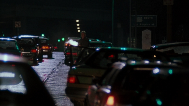Frame from Lethal Weapon — standing, street, uniform