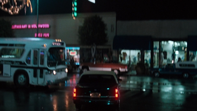 Wide shot frame from Lethal Weapon — street, car, night