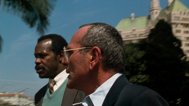Frame from Lethal Weapon — standing, suit, tie