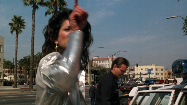 Wide shot frame from Lethal Weapon — standing, walking, street