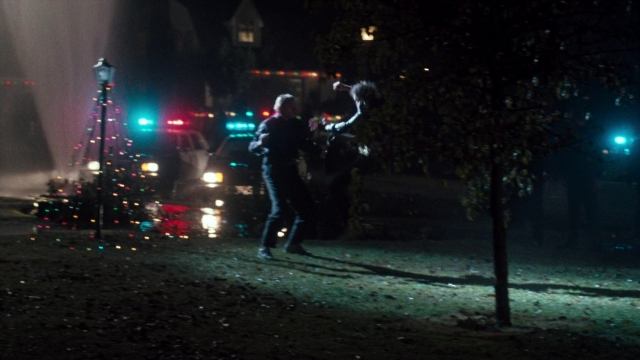 Wide shot frame from Lethal Weapon — standing, street, night