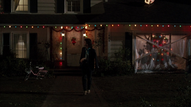 Wide shot frame from Lethal Weapon — walking, night, house