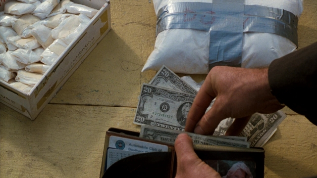 Wide shot frame from Lethal Weapon — table, hand, food