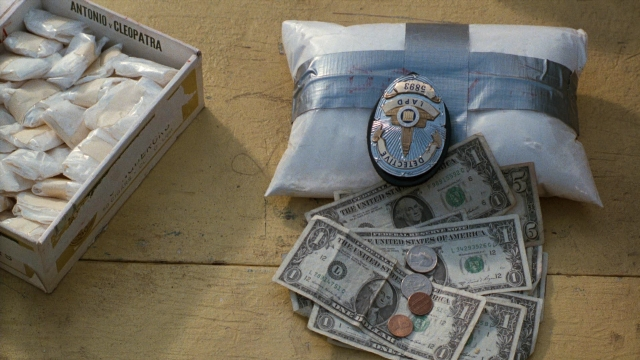 Frame from Lethal Weapon — table, bag, box