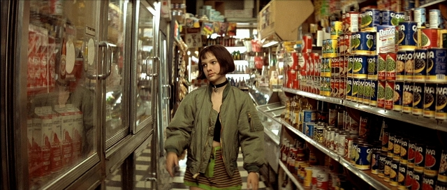 Wide shot frame from Léon — walking, face, hair