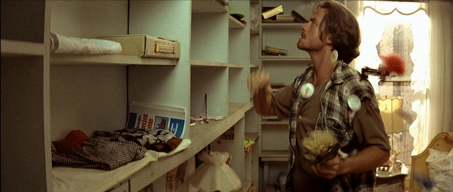 Frame from Léon — book, standing, room