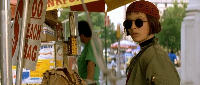 Wide shot frame from Léon — standing, walking, street