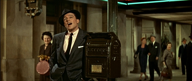 Wide shot frame from Léon — standing, walking, street