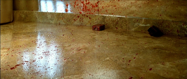 Wide shot frame from Léon — bathroom, window