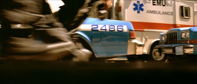 Frame from Léon — street, car, night