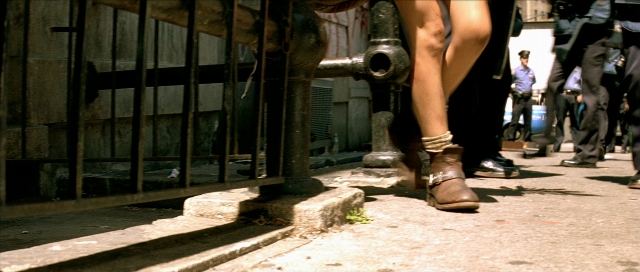 Wide shot frame from Léon — standing, walking, street