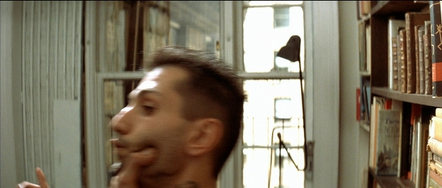 Frame from Léon — dialogue, street, hand
