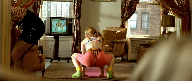 Wide shot frame from Léon — sitting, room, dress