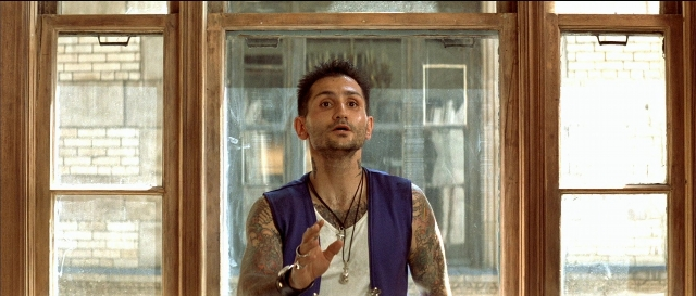 Wide shot frame from Léon — standing, shirt, face