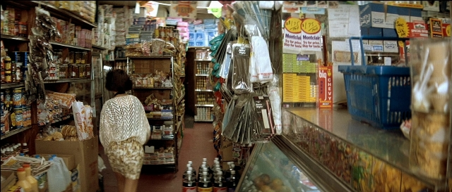 Wide shot frame from Léon — walking, dress, food