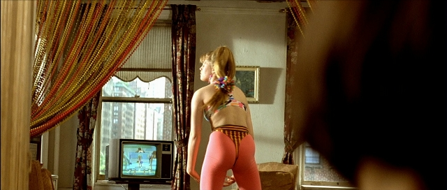 Medium shot frame from Léon — standing, room, television