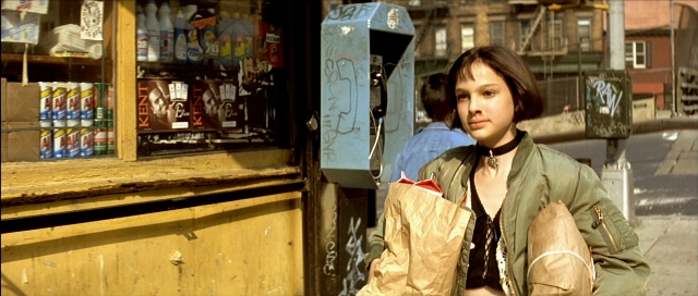 Wide shot frame from Léon — standing, walking, phone