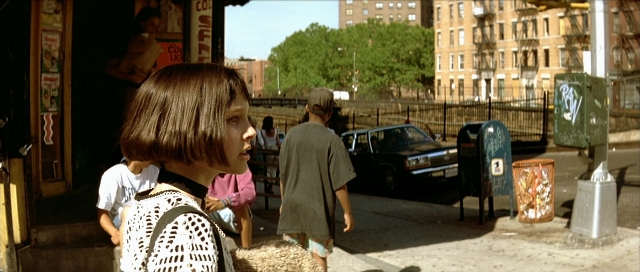 Wide shot frame from Léon — standing, walking, street