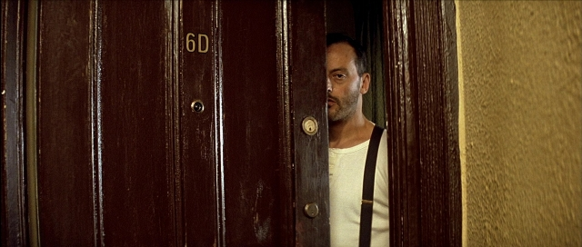 Wide shot frame from Léon — room, door, shirt