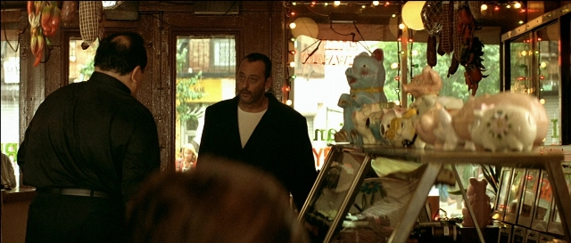 Wide shot frame from Léon — standing, beard, face