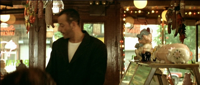 Wide shot frame from Léon — standing, room, restaurant