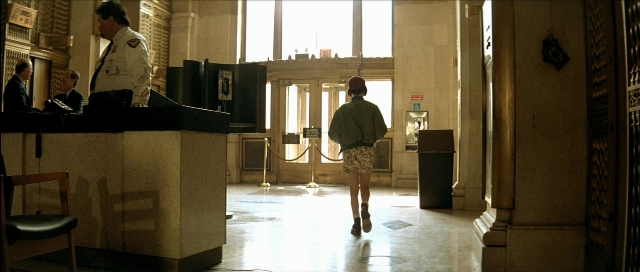 Wide shot frame from Léon — sitting, standing, walking