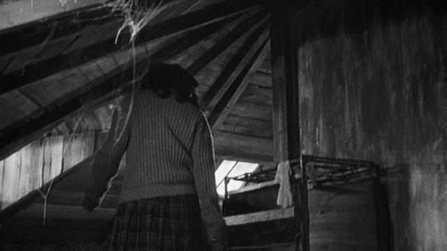 Wide shot frame from Léon Morin, prêtre — standing, room, house