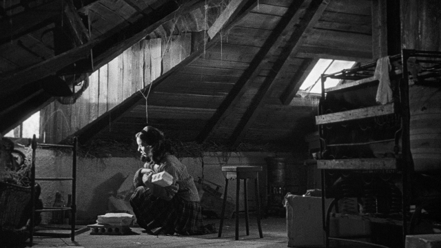 Wide shot frame from Léon Morin, prêtre — sitting, room, house