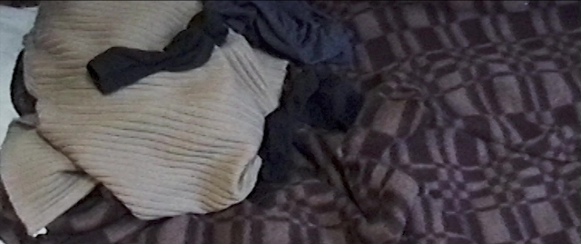 Wide shot frame from Compartiment n°6 — bed, shirt