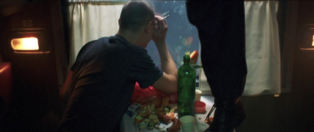 Wide shot frame from Compartiment n°6 — sitting, room, table