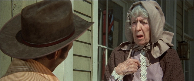 Medium shot frame from Blazing Saddles — standing, hat, face