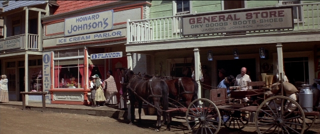 Wide shot frame from Blazing Saddles — sitting, standing, walking