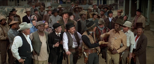 Wide shot frame from Blazing Saddles — standing, person, human face