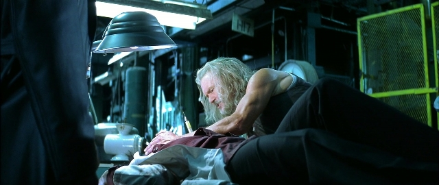 Wide shot frame from Blade — room, bed, hand